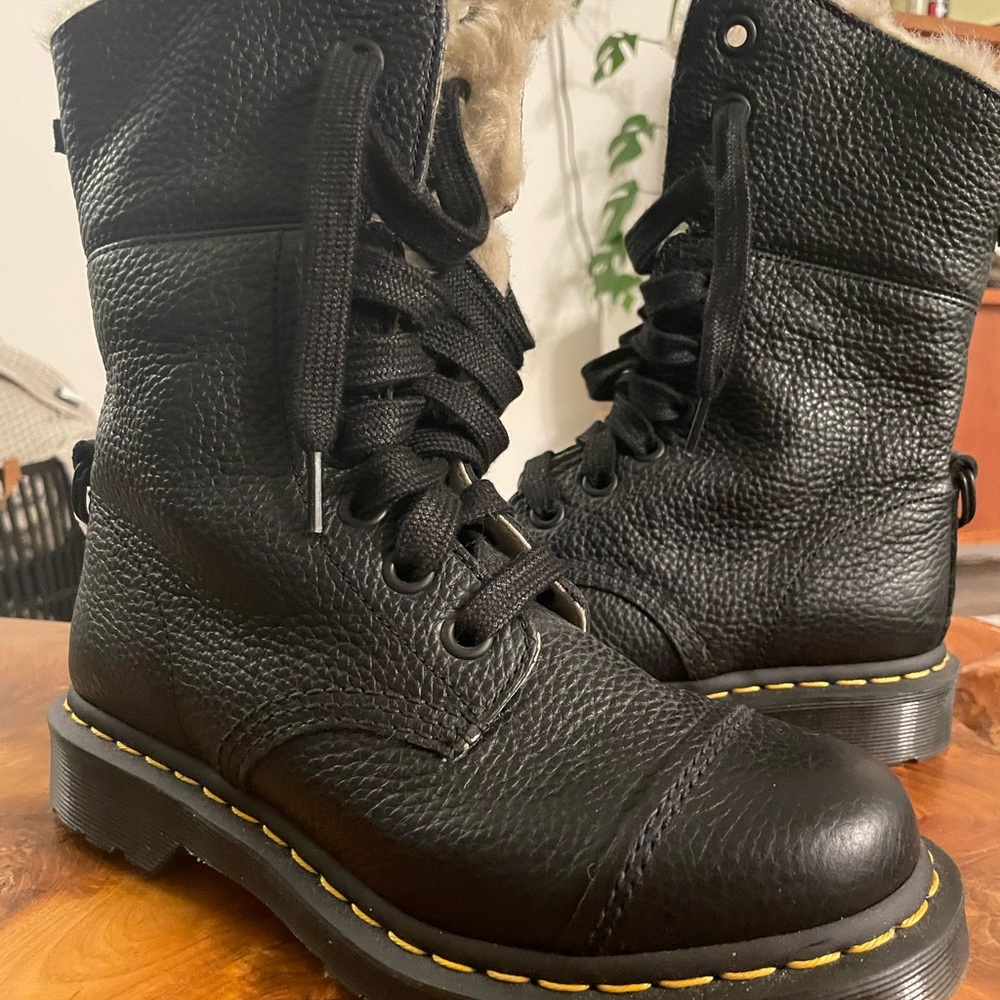 Lace up mid calf womens doc martens with fur. Never worn. Size 7.